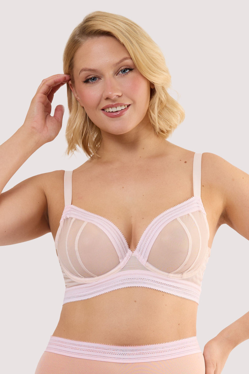 Model wears a icon blush pink microfiber moulded cup bra with light pink moulded microfibre and underwired, full cups.