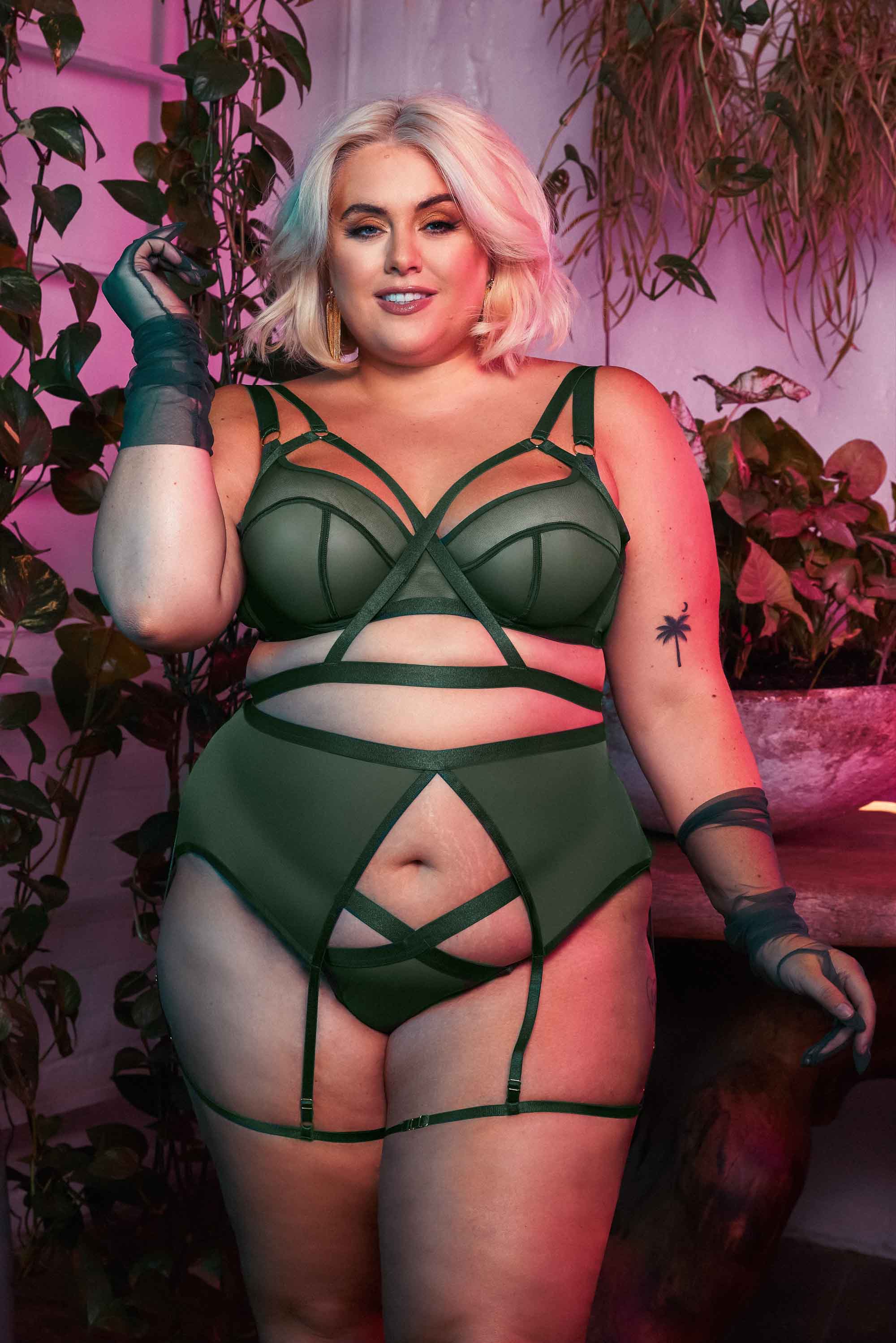 Green satin harness style brazilian brief, worn with a matching bra and suspender by Felicity Hayward.