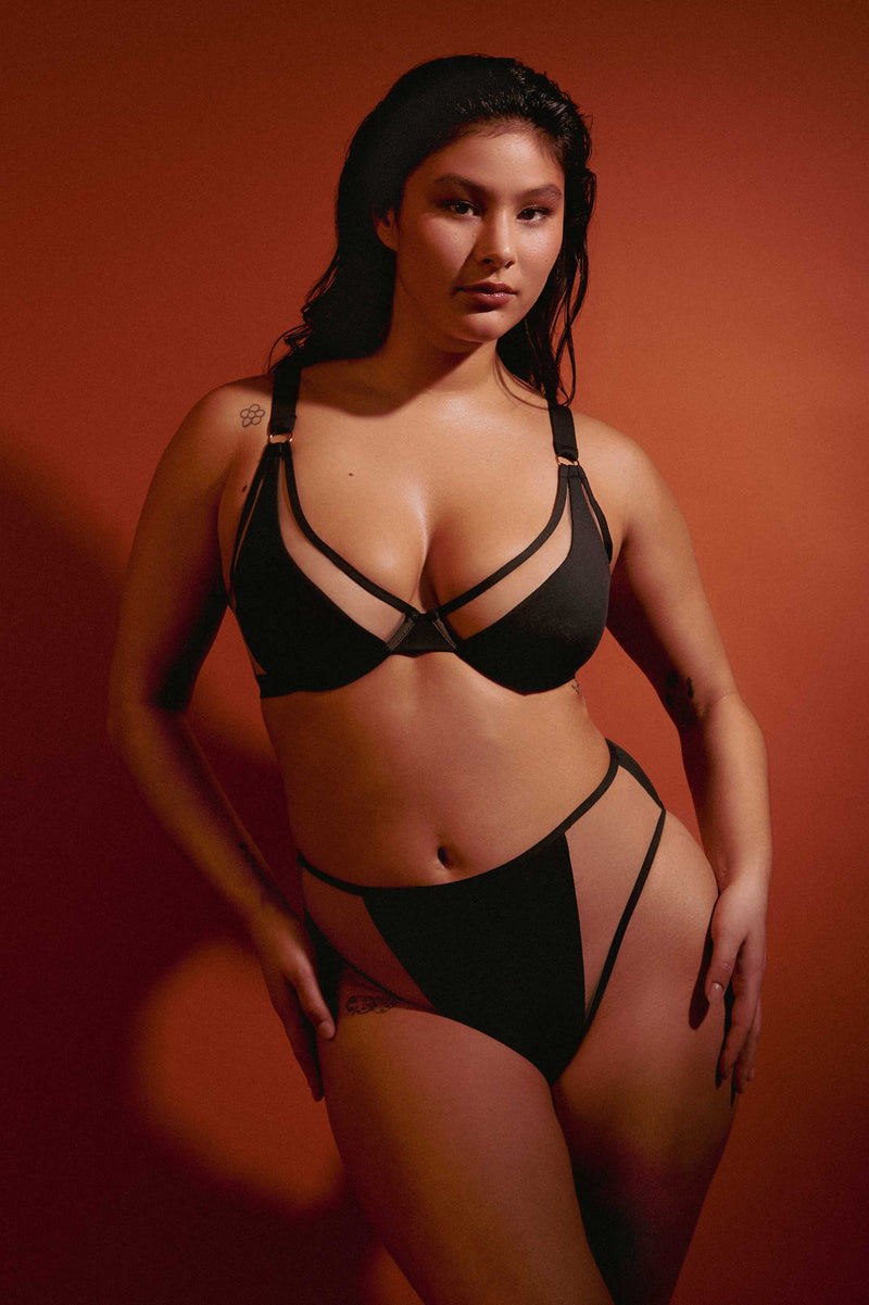 model wears black and nude mesh panel bikini sexy swimwear set