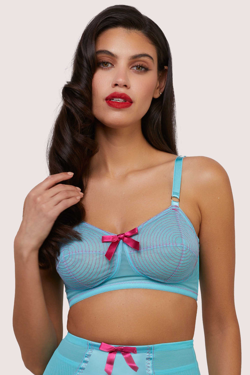 Model wears electric sky blue retro mesh spiral bullet bra with shoulder straps