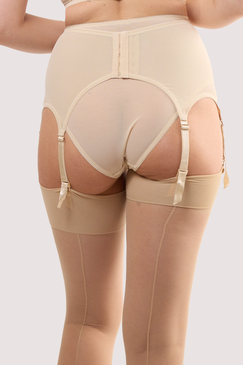 Model shows the back of a champagne satin 6 strap retro everyday suspender with adjustable suspender straps with elasticated for comfort.