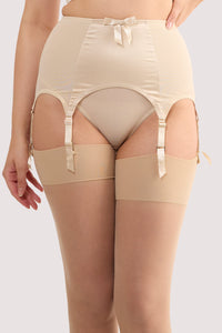Model wears a champagne satin 6 strap retro everyday suspender with six adjustable straps, soft and smooth finish with a matching brief.