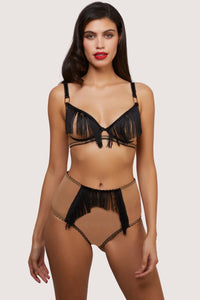 Model wears retro nude mesh and black fringe lingerie set