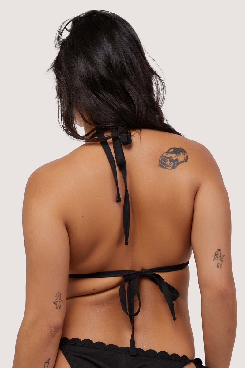 model shows black tie fastening bikini back