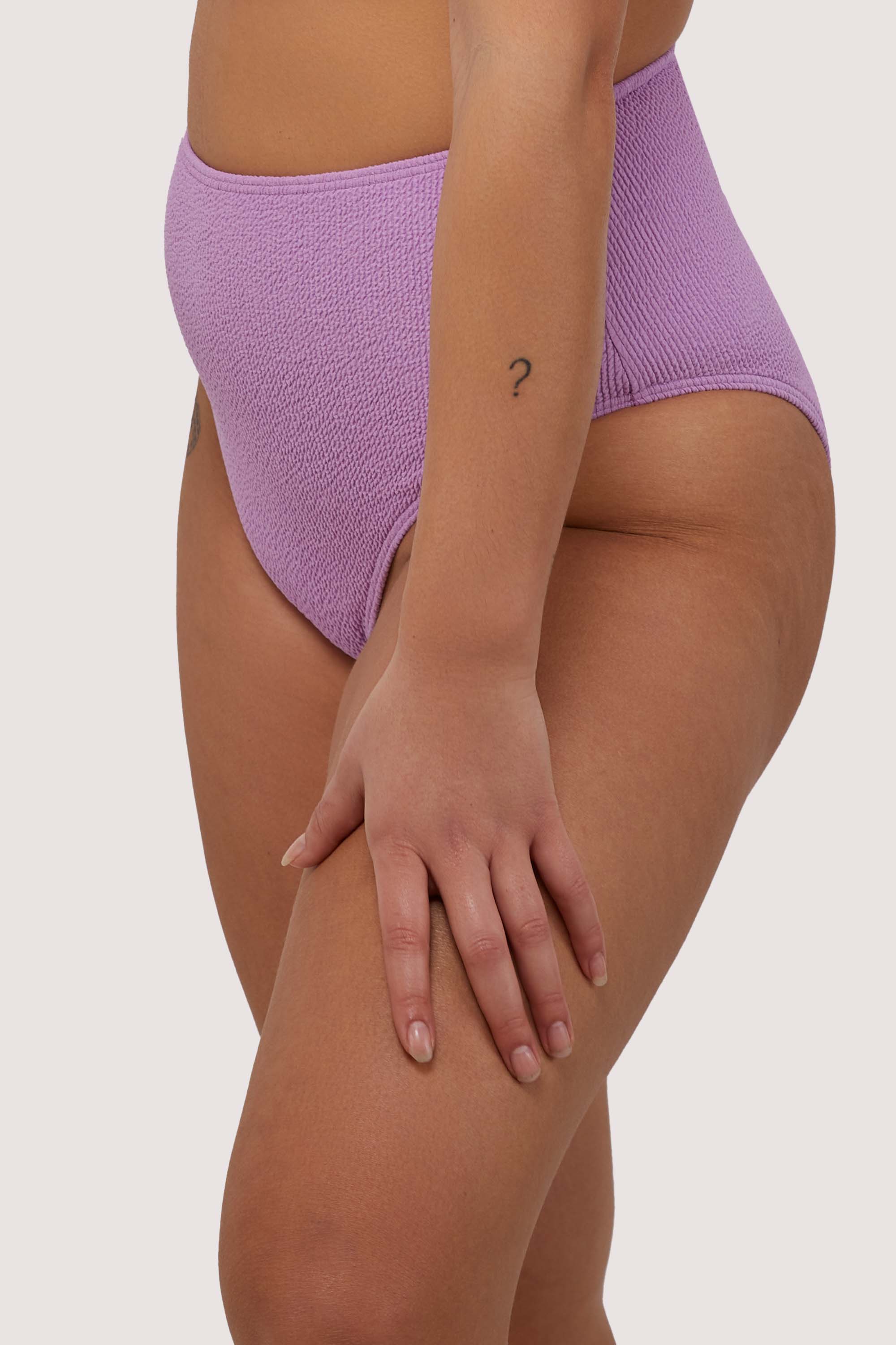 model wears high waist lilac scrunch fabric bikini bottoms