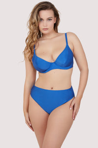 Model wears blue underwire bikini top and high waist bikini bottom set