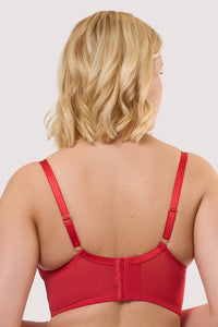 Model shows the back of a eddie ruby red crossover balconette bra with adjustable straps and hook & eye closure.