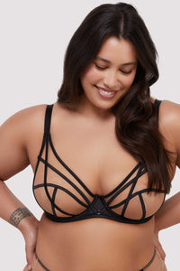 model wears black mesh bra with straps