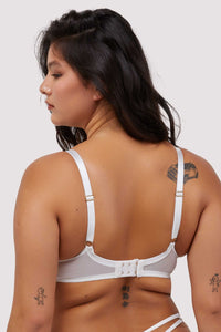 Model shows white hook and eye fastening bra back and adjustable shoulder straps
