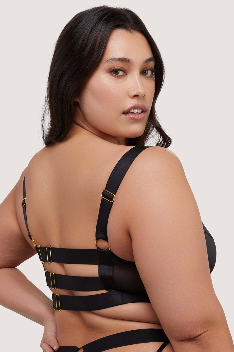 model shows black g-hook fastening harness bra back