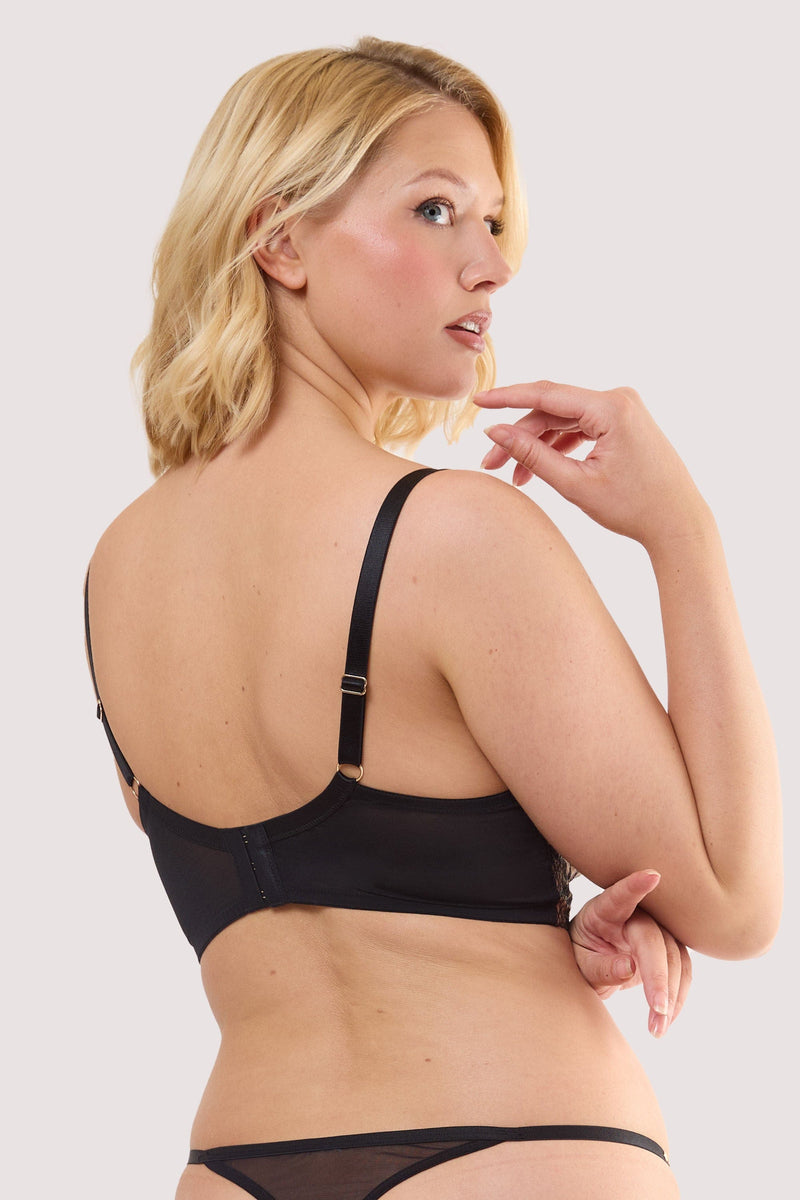Model shows the back of a cindy black floral embroidery longline bra with Hook-and-eye fastening style back.