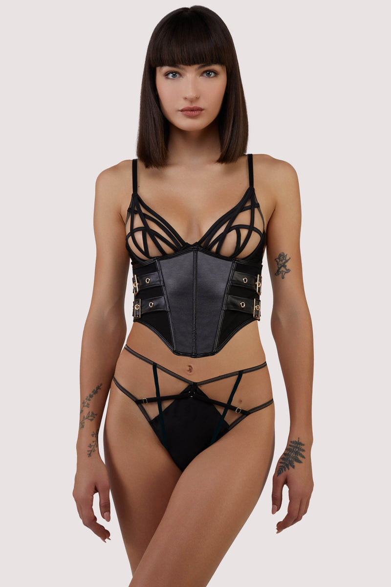 model wears underbust corset with black lingerie set