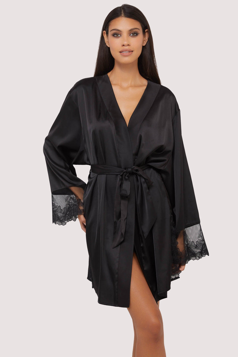 Model wears sexy black satin tie waist robe with embroidered lace trim