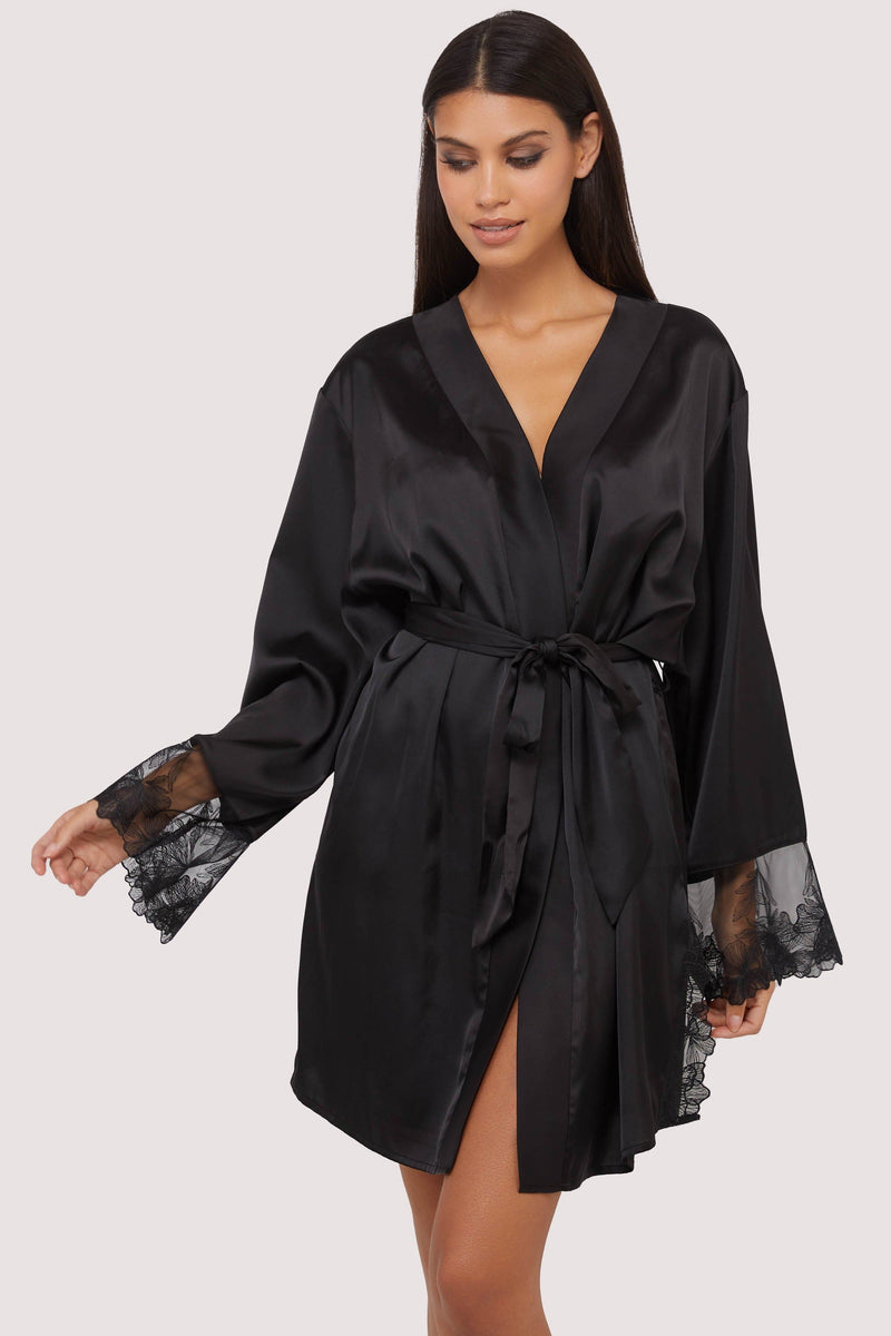 Model wears sexy black satin tie waist robe with embroidered lace trim