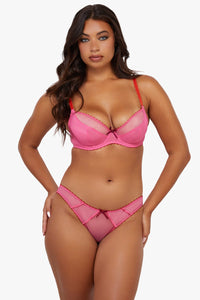 Model wears pink supportive plunge net bra and matching brief