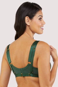 Back view of a green satin harness style bra.