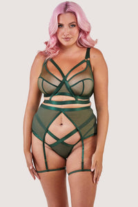 Green satin harness style suspender, seen with matching brief and bra.