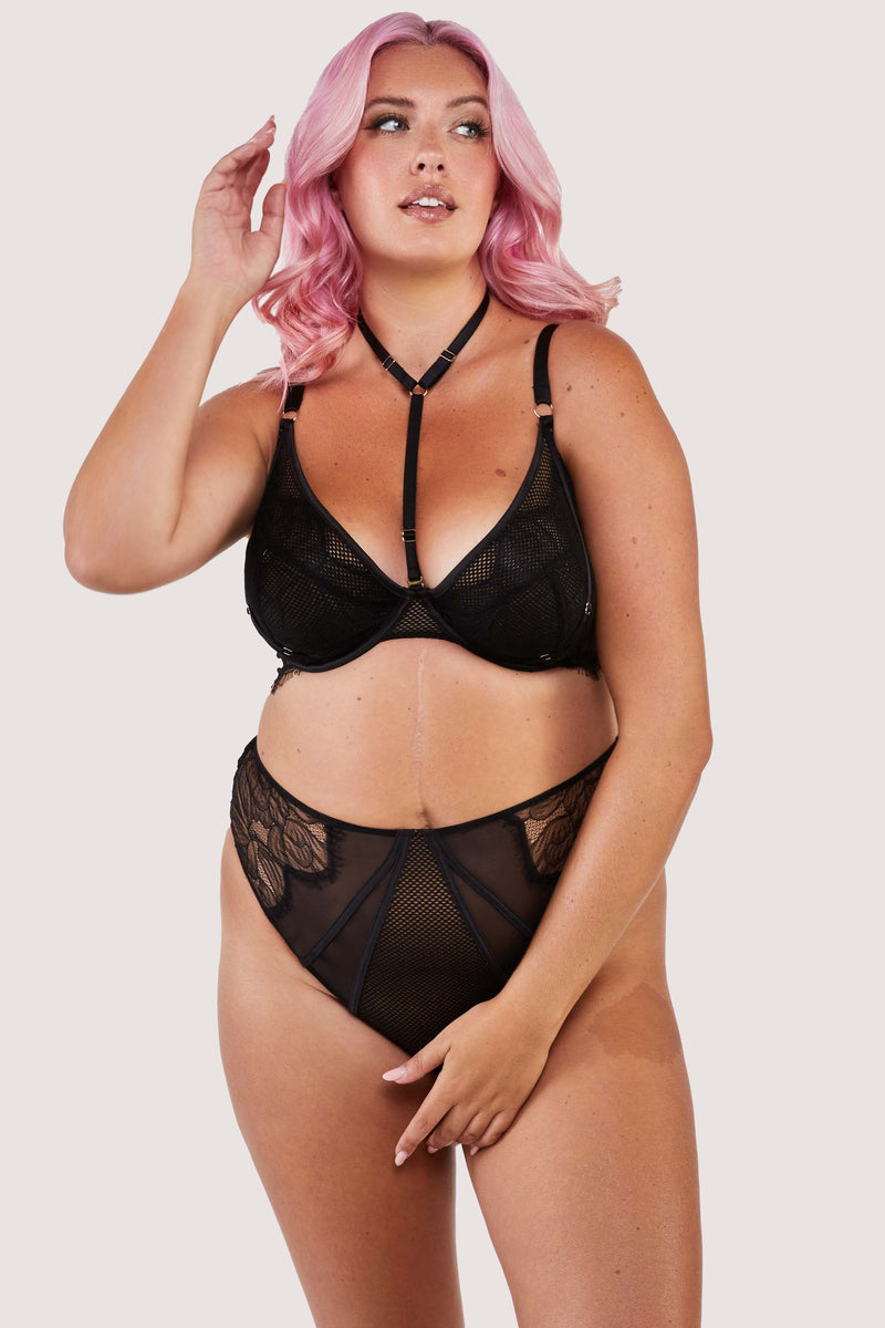 Black panelled mesh and lace crotchless thong with lace detailing, seen with a matching harness bra