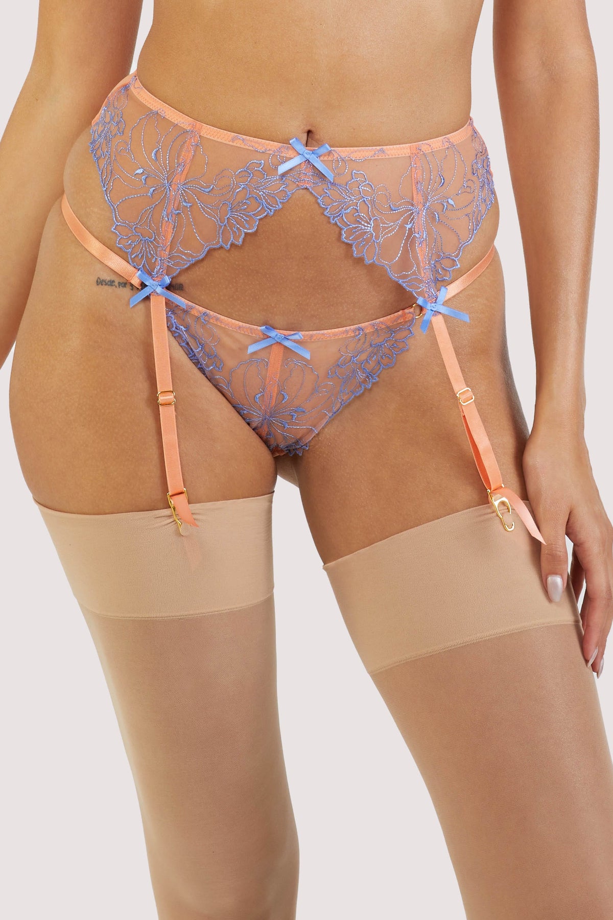Orange mesh suspender with lacy blue-lilac detailing on the front.