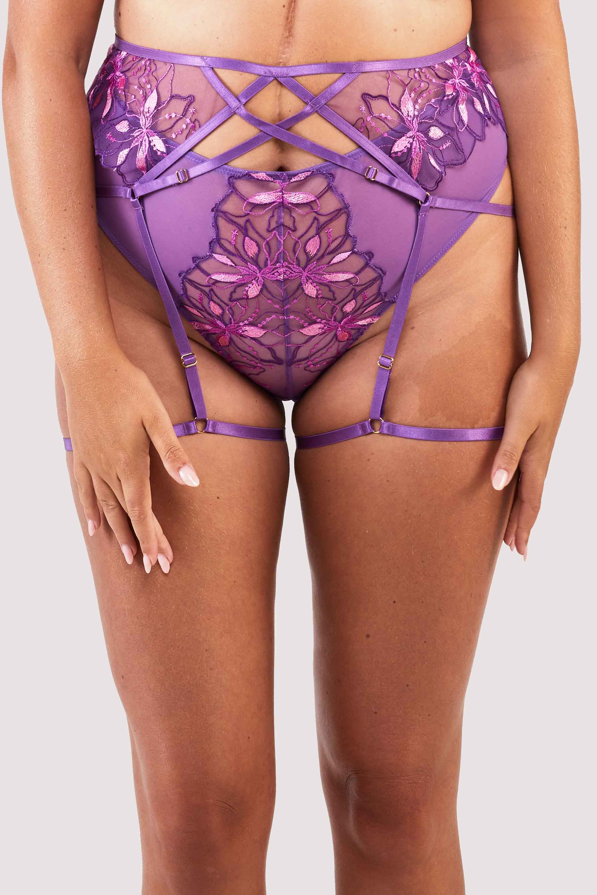 4 strap suspender with purple straps over the stomach, hips and thighs