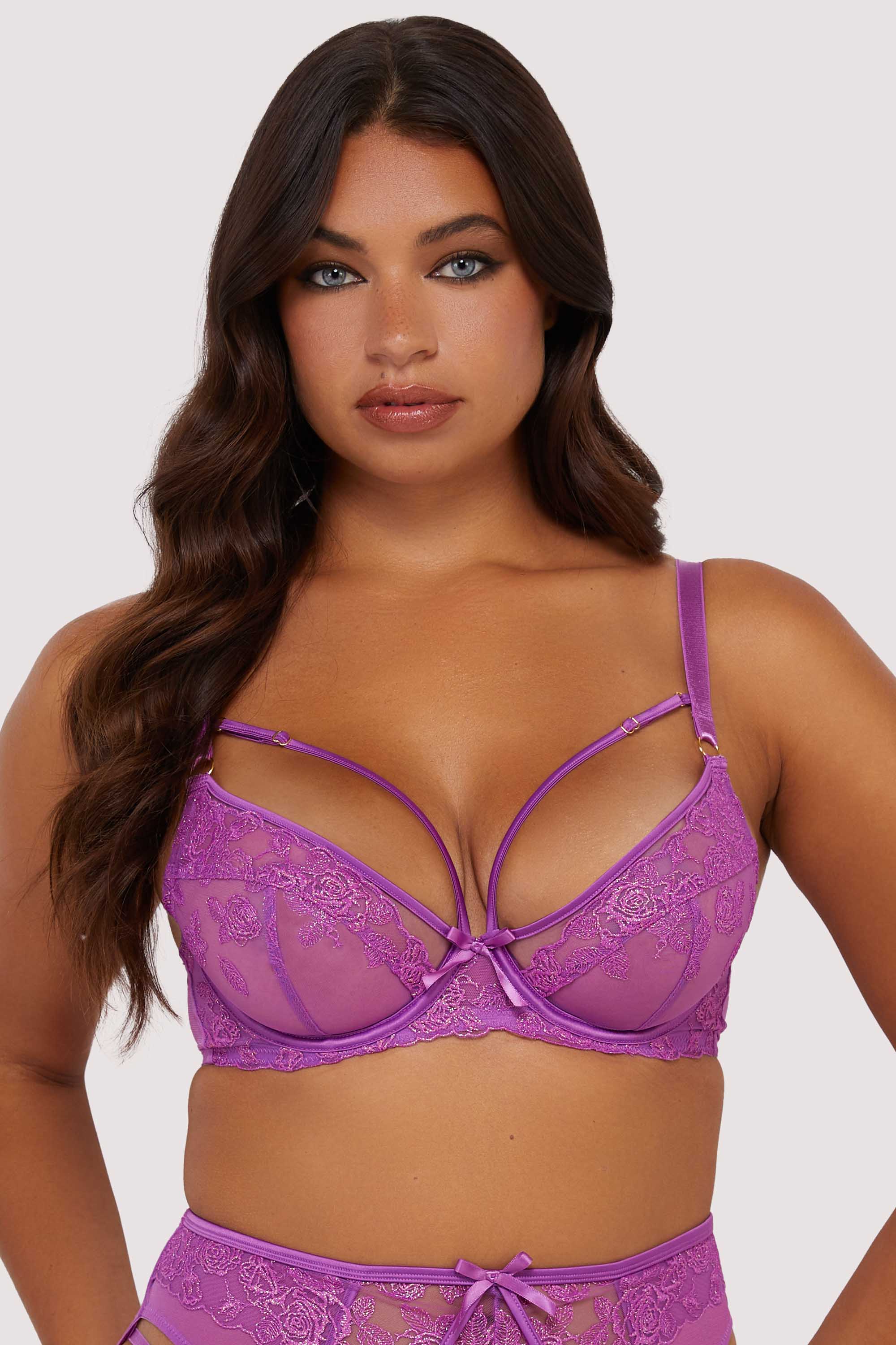 Model wears purple lace longline DD+ plunge bra with harness straps