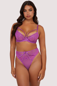 Model wears purple strappy lace lingerie set