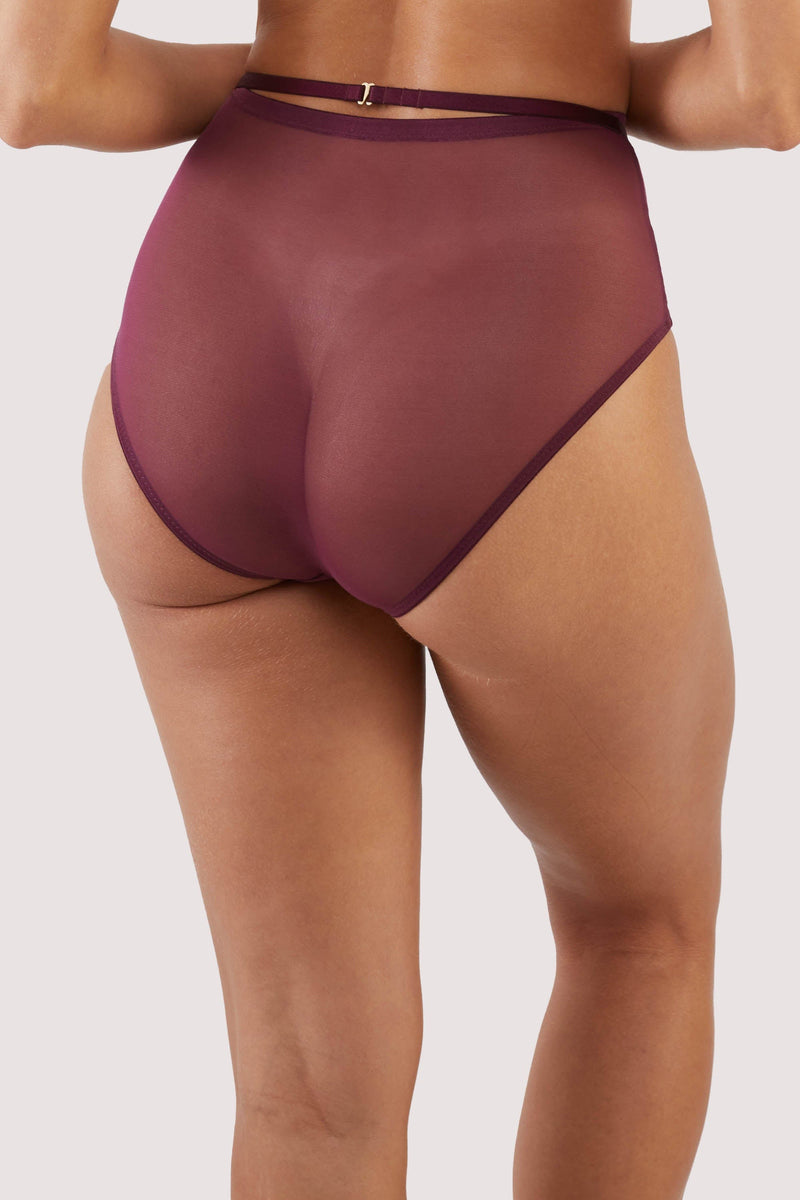 Back view of dark purple-red mesh brief with visible gold hardware and crossover panelling across the front.