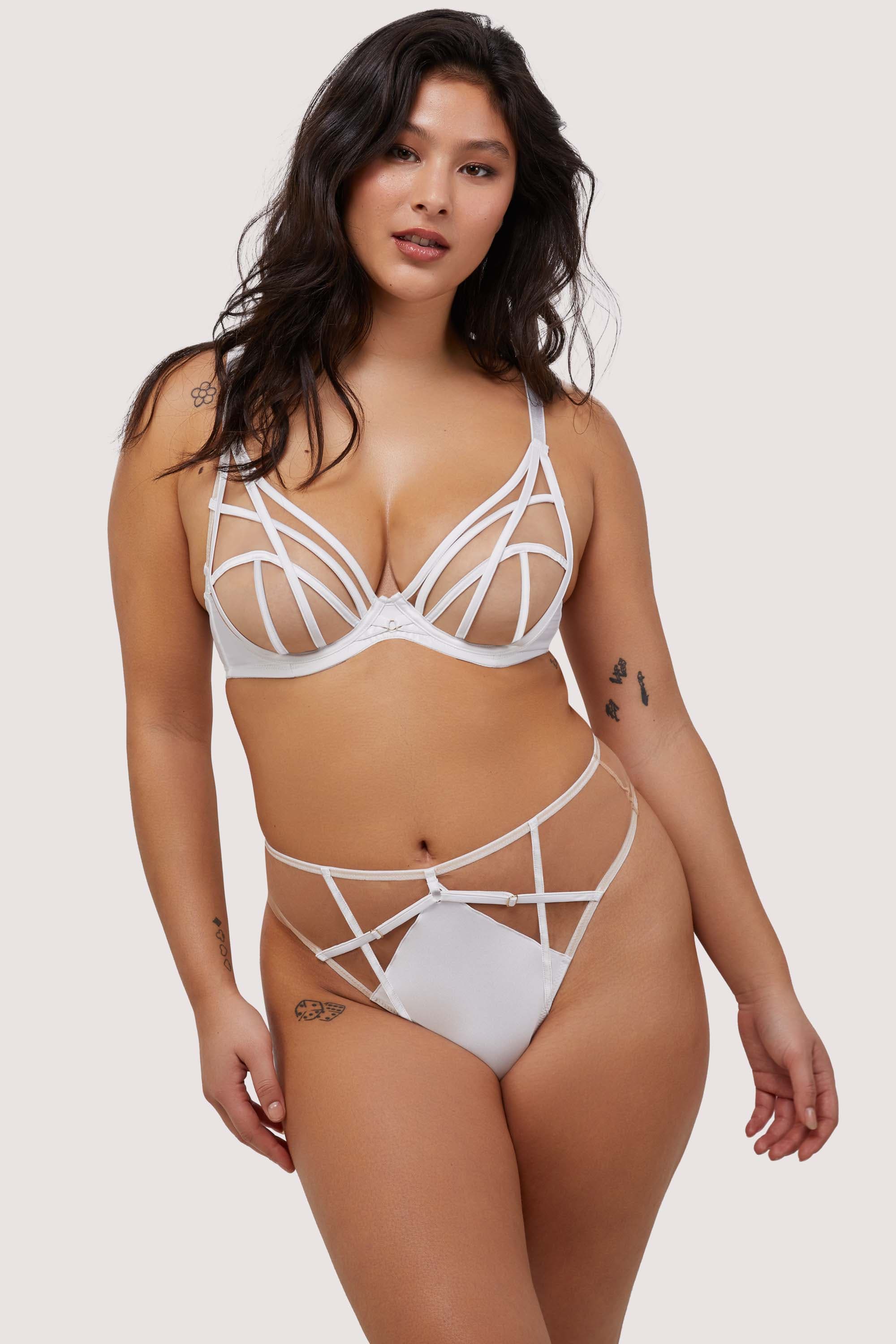 Model wears sexy white strap detail lingerie set