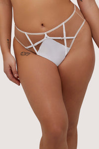 Model wears white strap detail high-waist thong