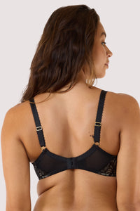 Model shows back of black sheer balconette bra with  adjustable straps hook and eye fastening longline underband