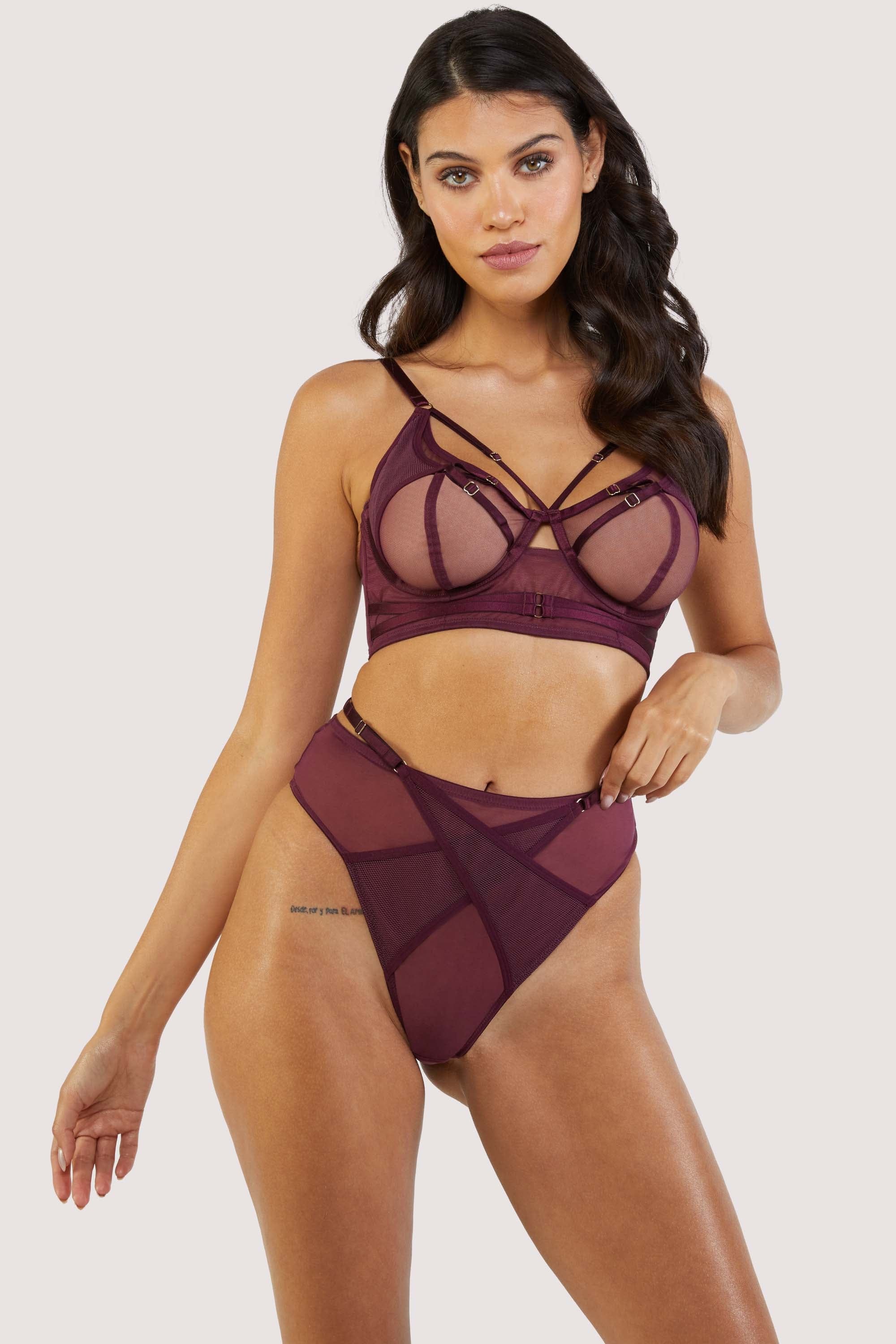 Dark purple-red mesh bra with strap detailing over the bust and visible gold hardware. Paired with matching thong.