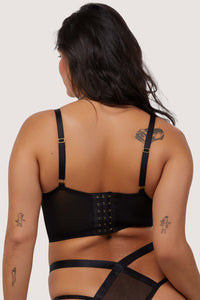 Model shows adjustable straps and hook any eye fastening back of black bustier