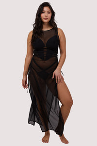 Model wears sexy sheer black mesh long dress with deep side splits