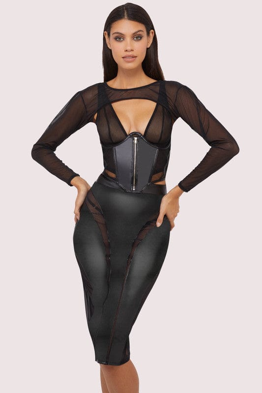 Model wears a black shrug with super cropped long sleeve bolero, with a matching underbust corset and pencil skirt.