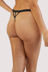 Black mesh thong with gold hardware and art deco style pattern on front.