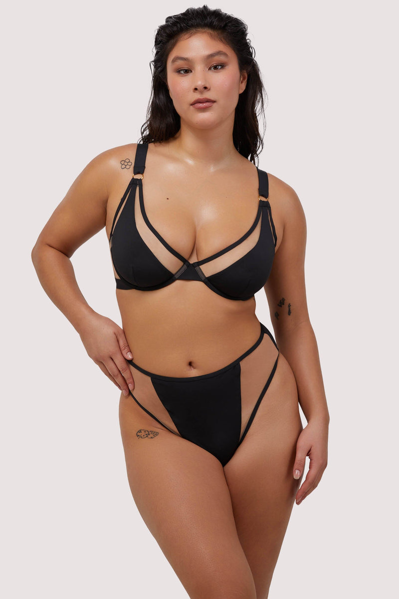 model wears sexy black underwire bikini set with nude mesh inserts