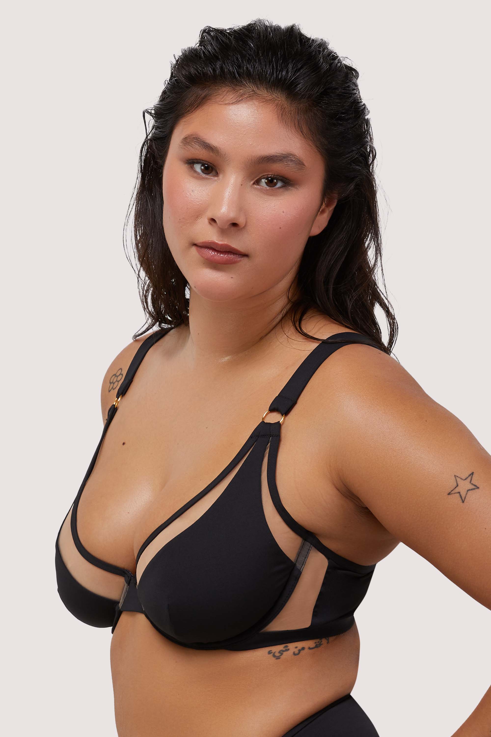model wears black and nude mesh sexy underwire bikini top with thick shoulder straps
