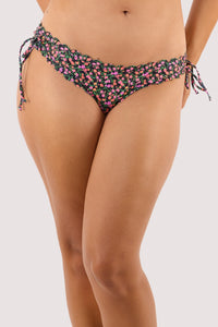 Model Wearing the Black Ditsy Scallop Brief, a low-rise, tie-side bikini bottom.