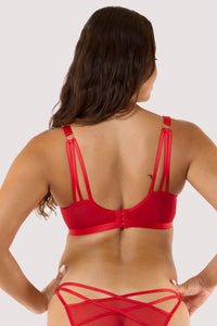 Model showing back of red deco embroidered plunge bra, showcasing its intricate design and vibrant color.