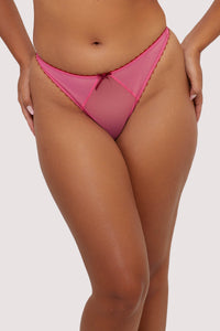Model wearing Pink mesh thong with burgundy bow and trims