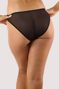 Model shows back of black lace brief with sheer mesh back full brief style