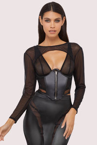 Model wears a black vegan leather underbust corset with underwire shaping and sheer mesh front with vegan leather, with a matching shrug.